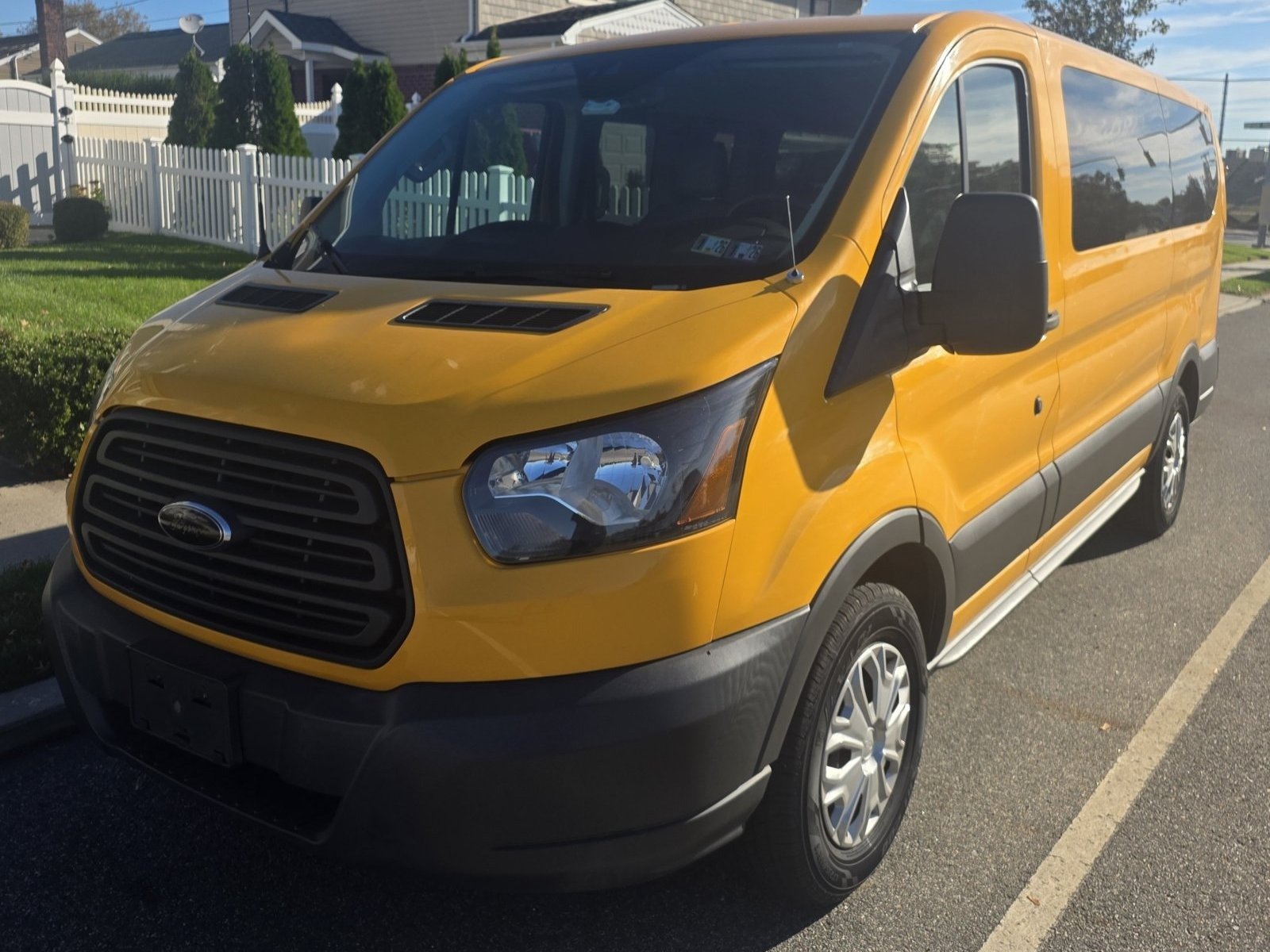 2018 Ford Transit 150 — Yellow Passenger Van — Front View